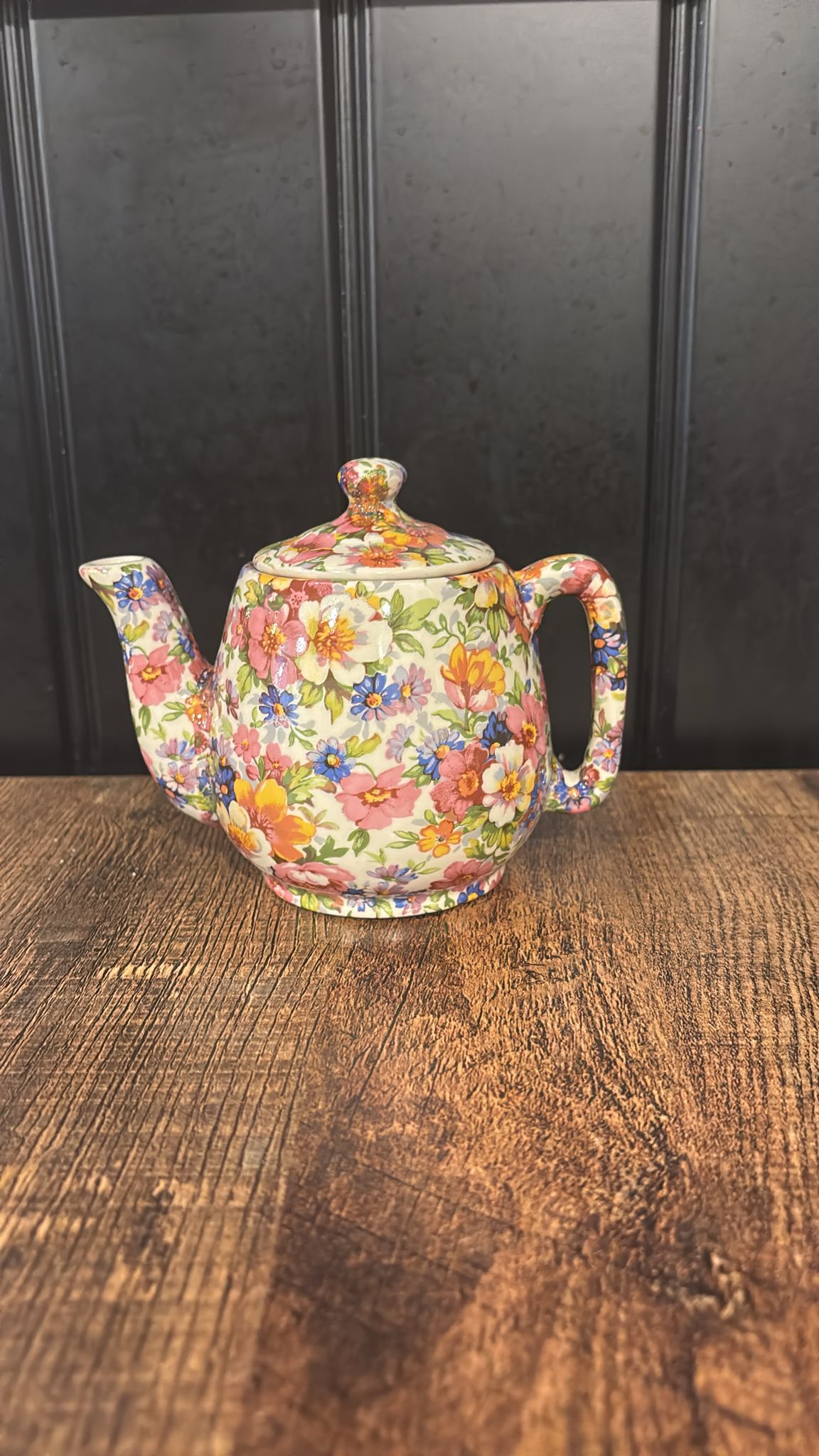 Decorative teapot with floral pattern on